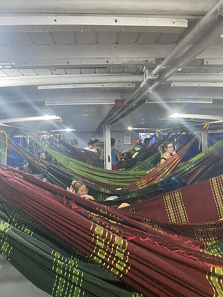 Photo of NDSU nursing students laying in hammocks on a boat in Amazonas, Brazil where they slept each night for 16 days.