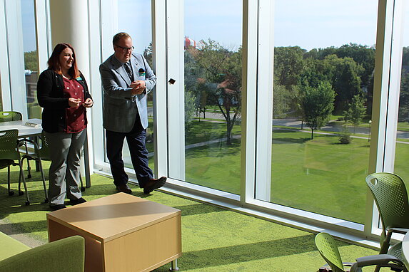 New faculty playing office corn hole during adult recess.