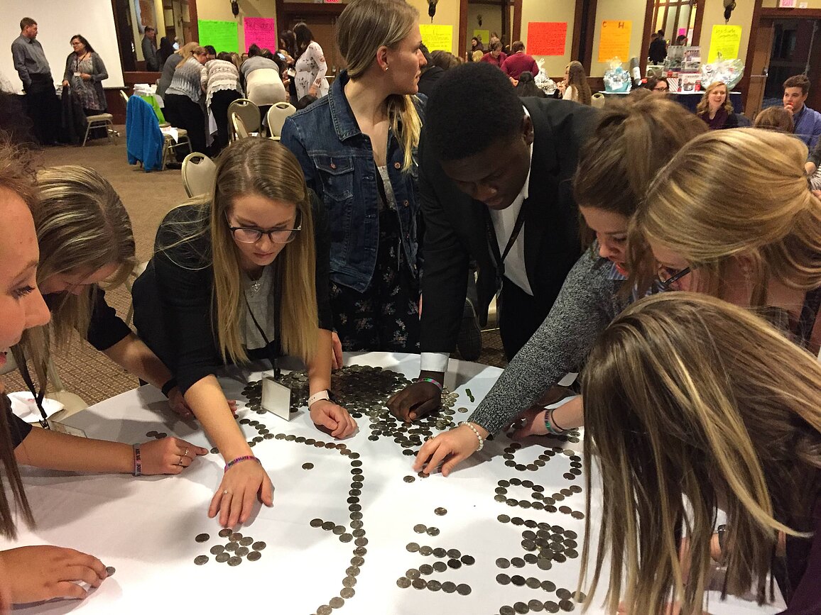 Image of students organizing coins