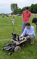 Photo of Andrew Jones with robot