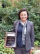 Photo of Marisol Berti with her award