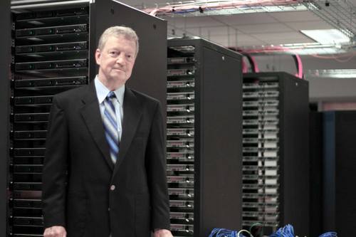 Photo of Bill Perrizo standing by server racks.